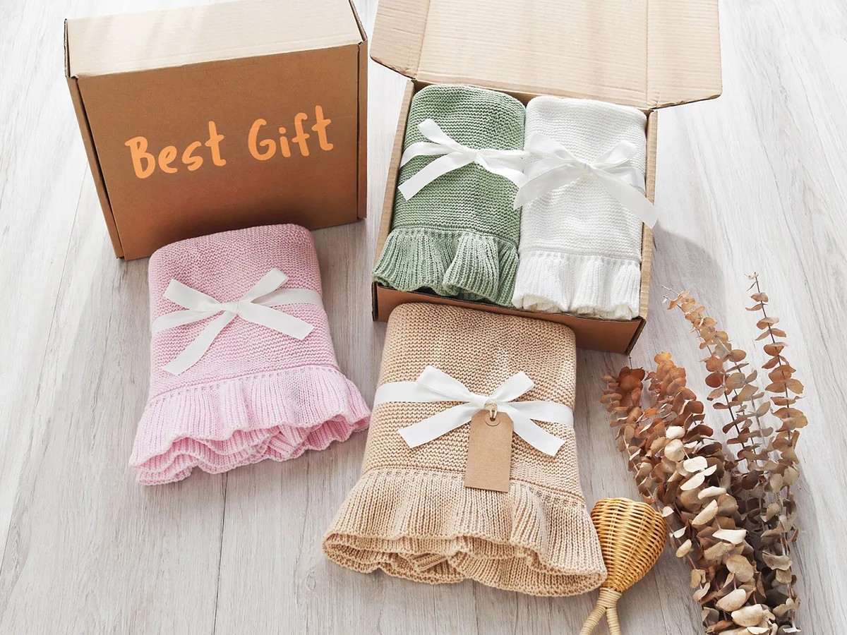 Gift packaged knitted baby blankets in assorted colors