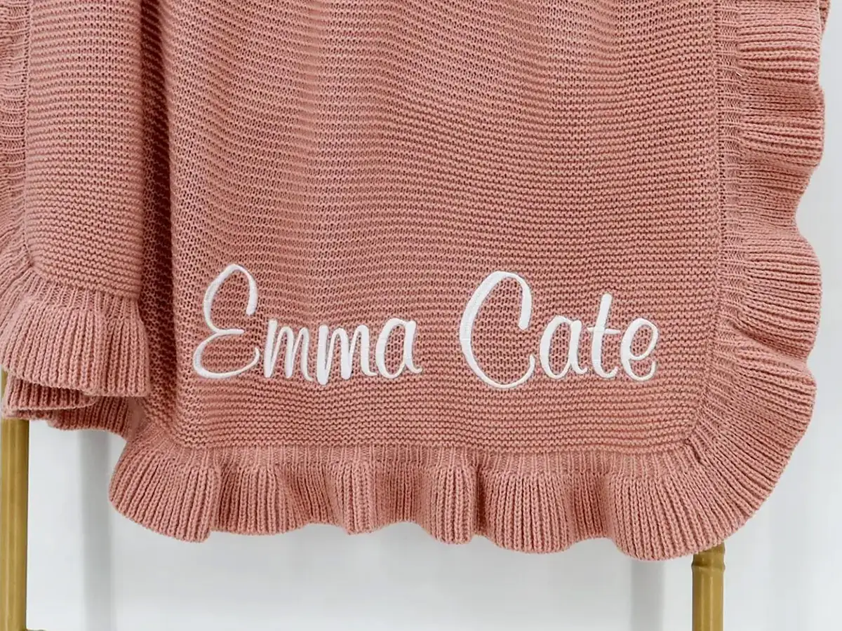 Personalized knitted baby blanket with embroidered name