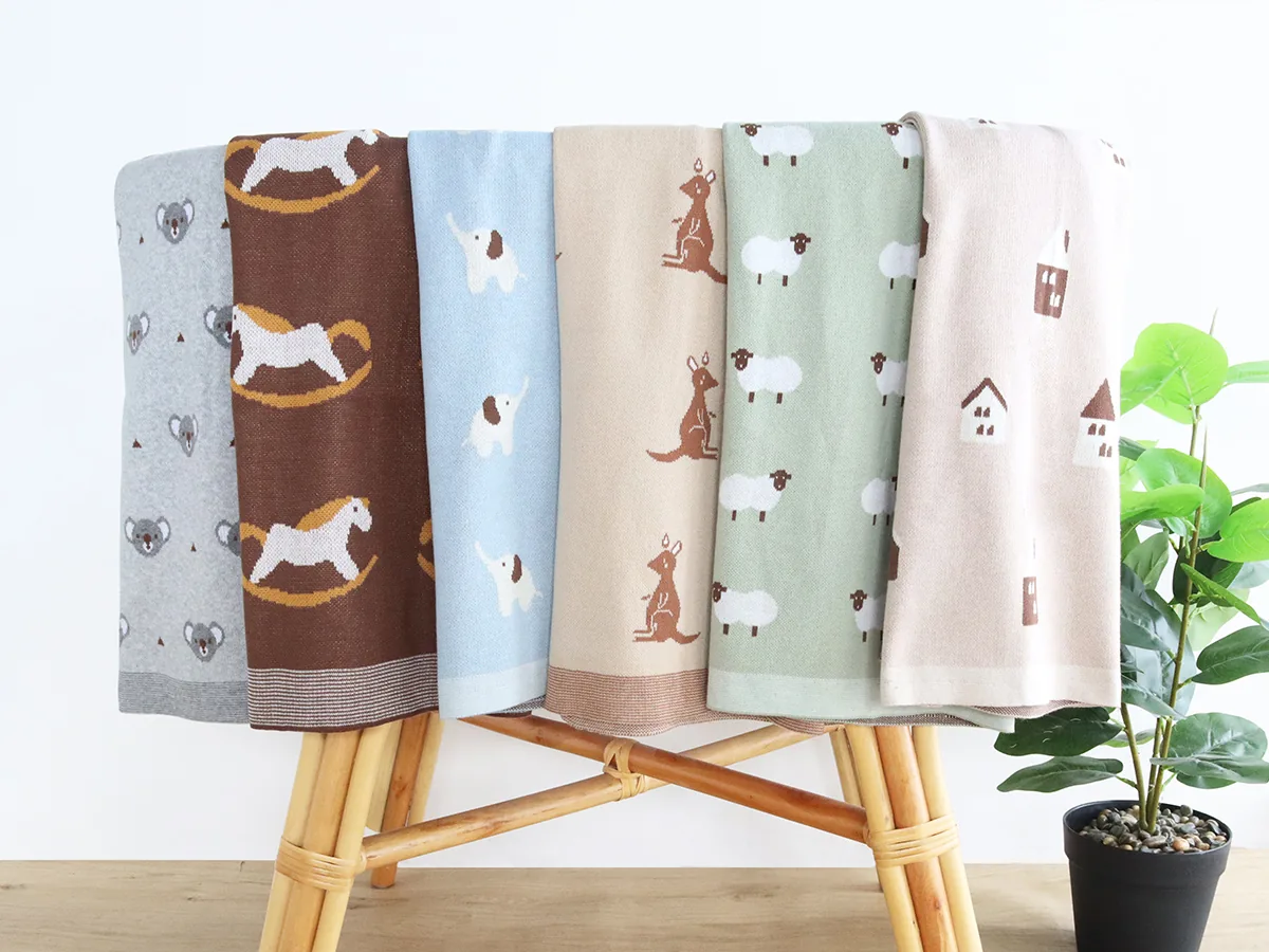 Printed baby blankets in coordinated colors and patterns