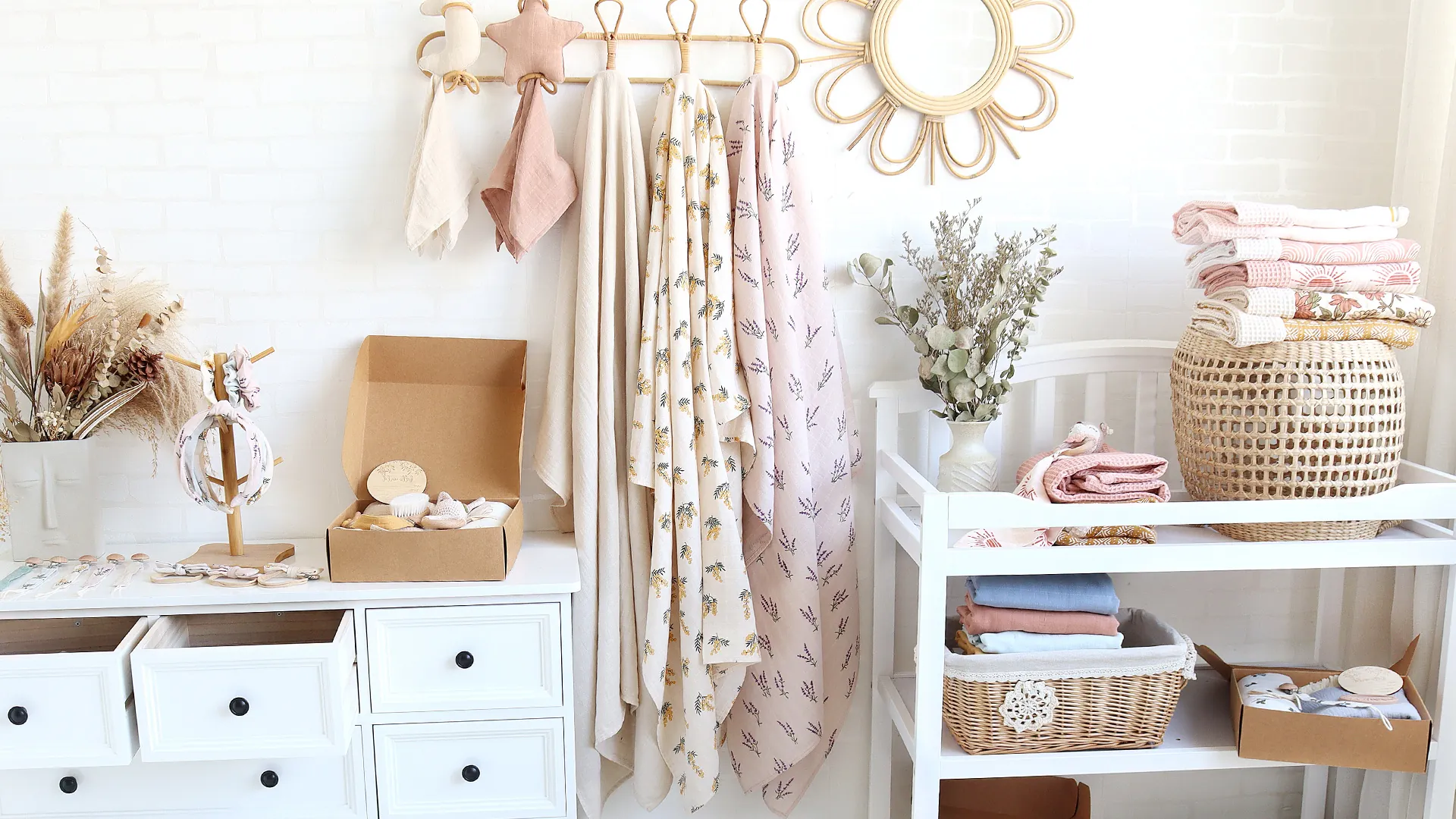 Baby product customization display with muslin swaddles textiles and gift packaging