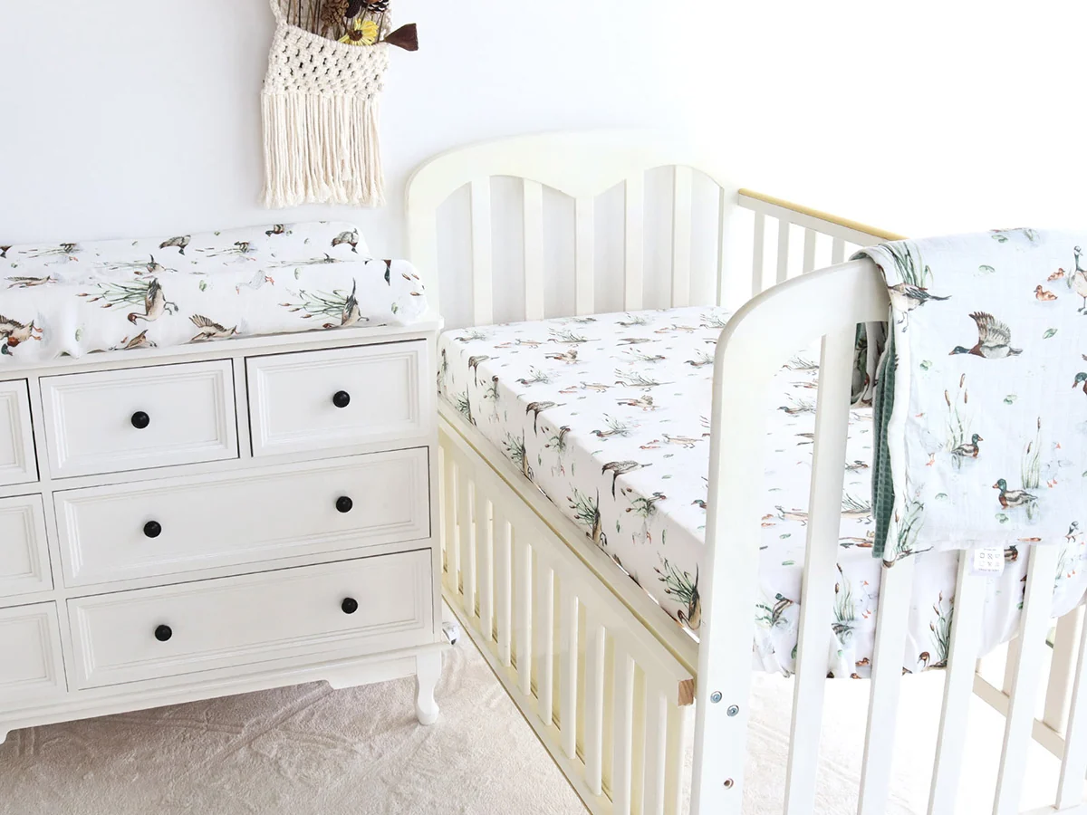 Coordinated nursery bedding set with crib sheet and changing pad cover