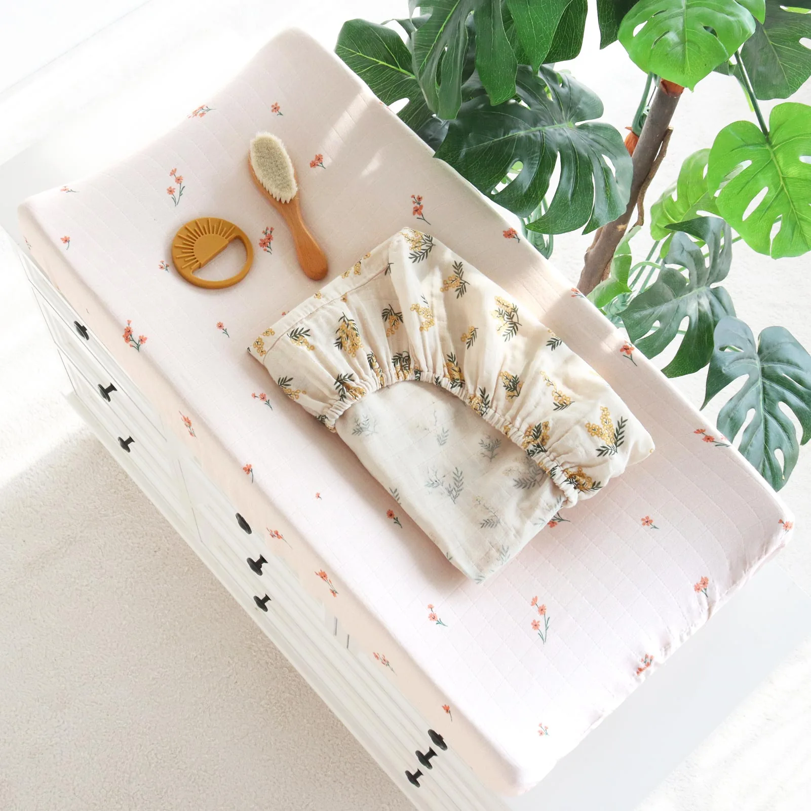 Printed muslin changing pad cover with coordinated nursery accessories