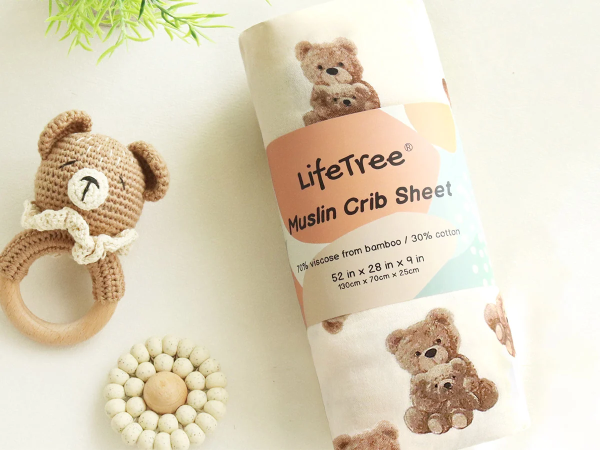 Retail packaged muslin crib sheet with crochet baby toys